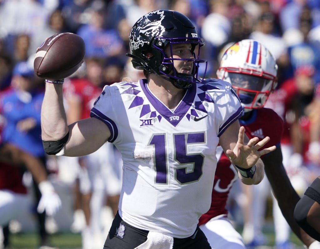 Quarterback Max Duggan of the TCU Horned Frogs passes in the second half against against the Kansas Jayhawks at David Booth Kansas Memorial Stadium on October 08, 2022 in Lawrence, Kansas. Photo by Ed Zurga/Getty Images via AFP.