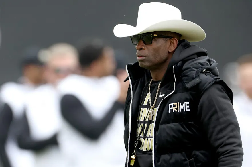 Head coach Deion Sanders of the Colorado Buffaloes watches as his team warms up as we look at our Colorado-TCU prediction
