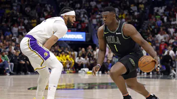 Zion Williamson of the New Orleans Pelicans is defended by Anthony Davis of the Los Angeles Lakers during a game at Smoothie King Center. We're backing Williamson in our NBA player props and best bets for Tuesday.
