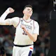Donovan Clingan #32 of the Connecticut Huskies celebrates as we offer our best Purdue vs. UConn prediction and expert pick for the men's national championship game on Monday.