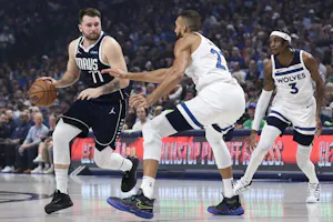 Luka Doncic of the Dallas Mavericks dribbles the ball against Rudy Gobert of the Minnesota Timberwolves during Game 3 of the Western Conference Finals. We're breaking down the Luka Doncic odds ahead of Game 4.