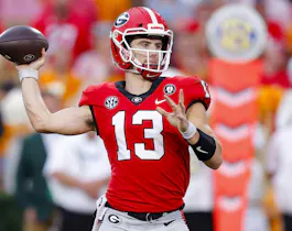 Stetson Bennett of the Georgia Bulldogs throws a pass against the Tennessee Volunteers during the third quarter at Sanford Stadium.