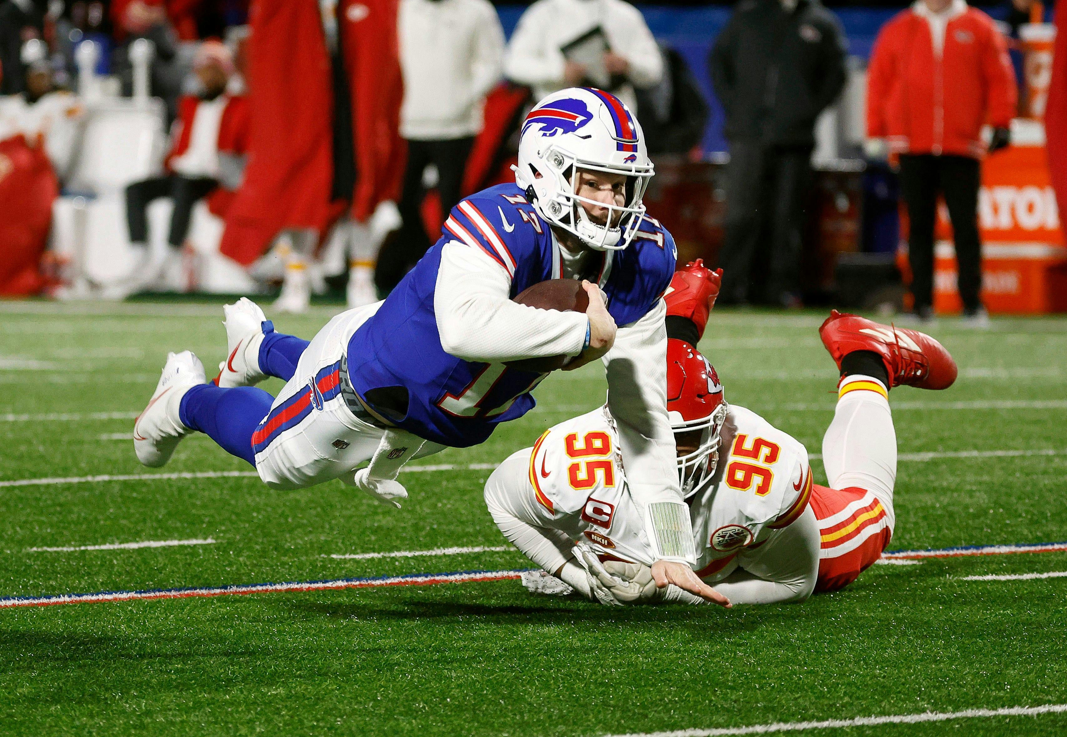 Buffalo Bills quarterback Josh Allen dives for a first down as we offer our Super Bowl picks and the case for and against every NFL playoff team to win the Super Bowl entering the NFL Divisional Round.