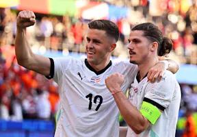 Austria's players Christoph Baumgartner (l) and Marcel Sabitzer celebrate at Euro 2024 as we offer our best Austria vs. Turkey prediction and expert picks for Tuesday's match in the Round of 16.
