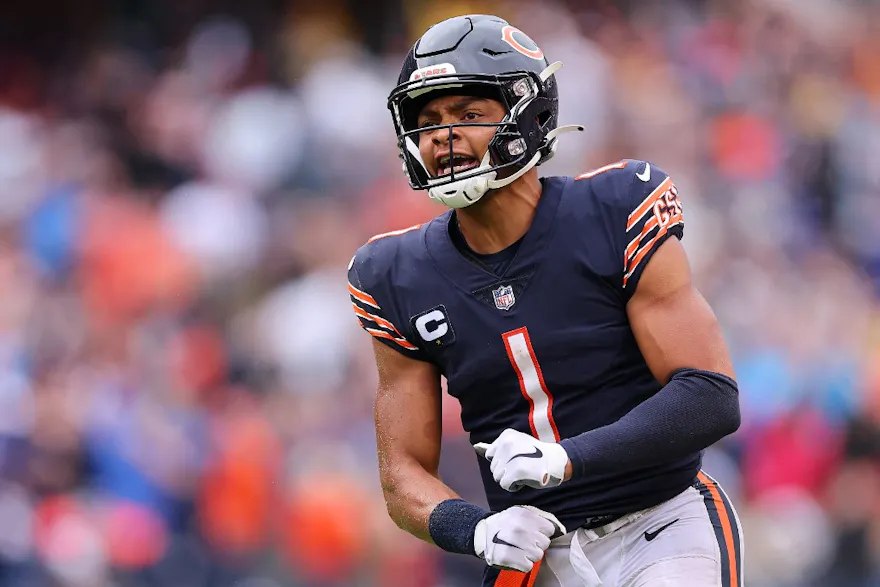 Justin Fields of the Chicago Bears celebrates a touchdown against the San Francisco 49ers at Soldier Field, and we offer our top Justin Fields player prop predictions based on the best NFL odds.