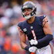 Justin Fields of the Chicago Bears celebrates a touchdown against the San Francisco 49ers at Soldier Field, and we offer new U.S. bettors our exclusive DraftKings promo code.