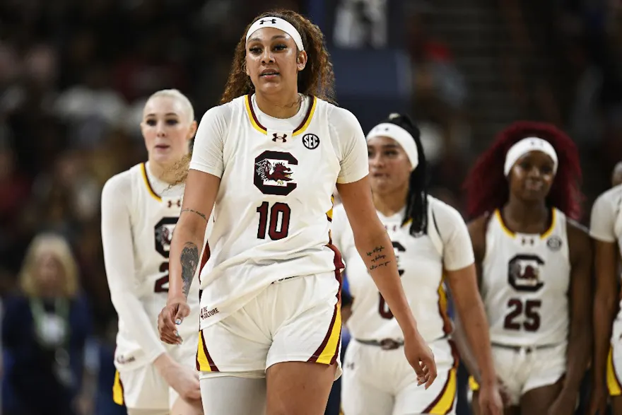 Kamilla Cardoso #10 of the South Carolina Gamecocks stand with her team as we look at the latest South Carolina vs. the field odds ahead of the 2024 NCAA Tournament.