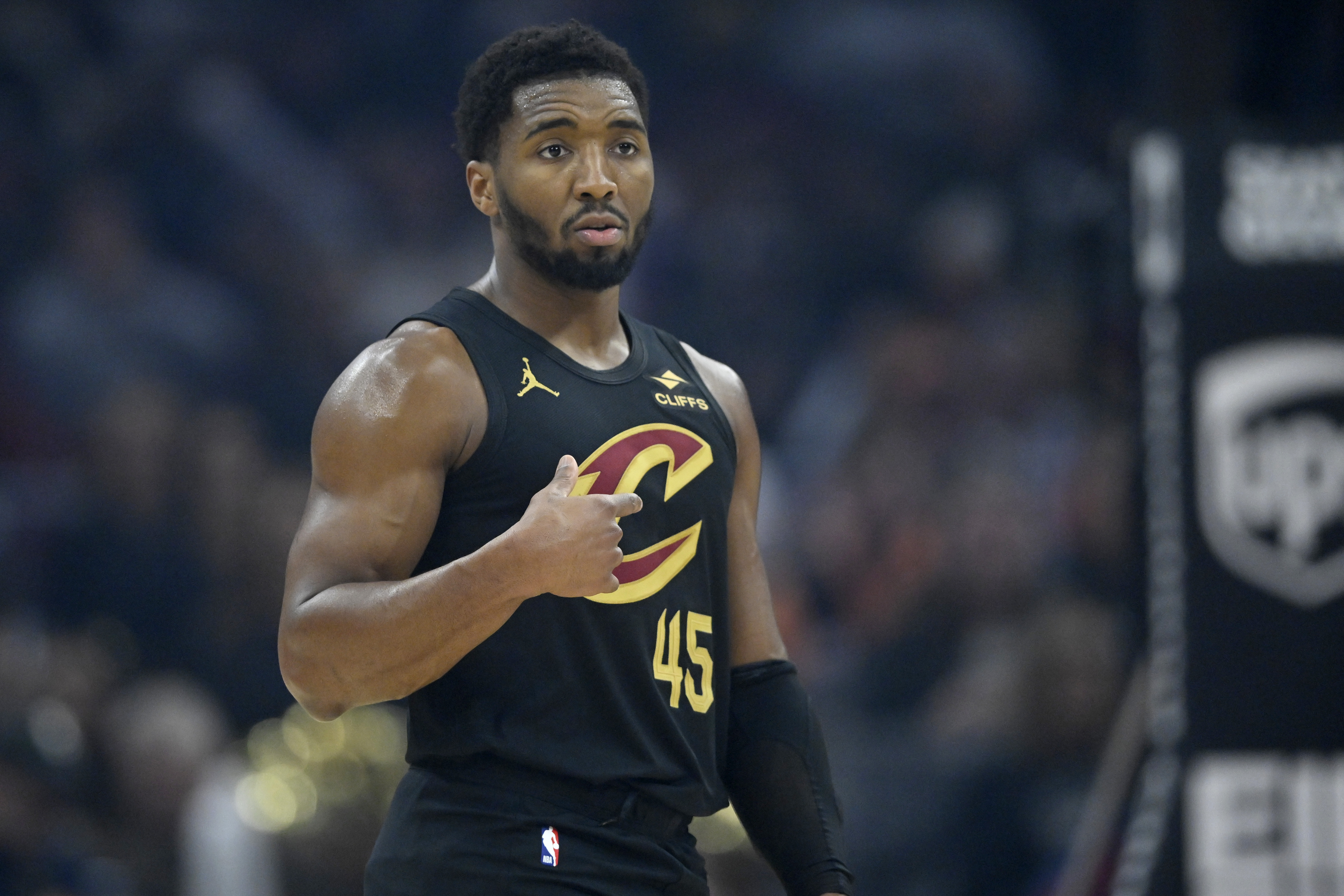 Cleveland Cavaliers guard Donovan Mitchell stands on the court as we make our best Cavaliers vs. Bulls player prop predictions