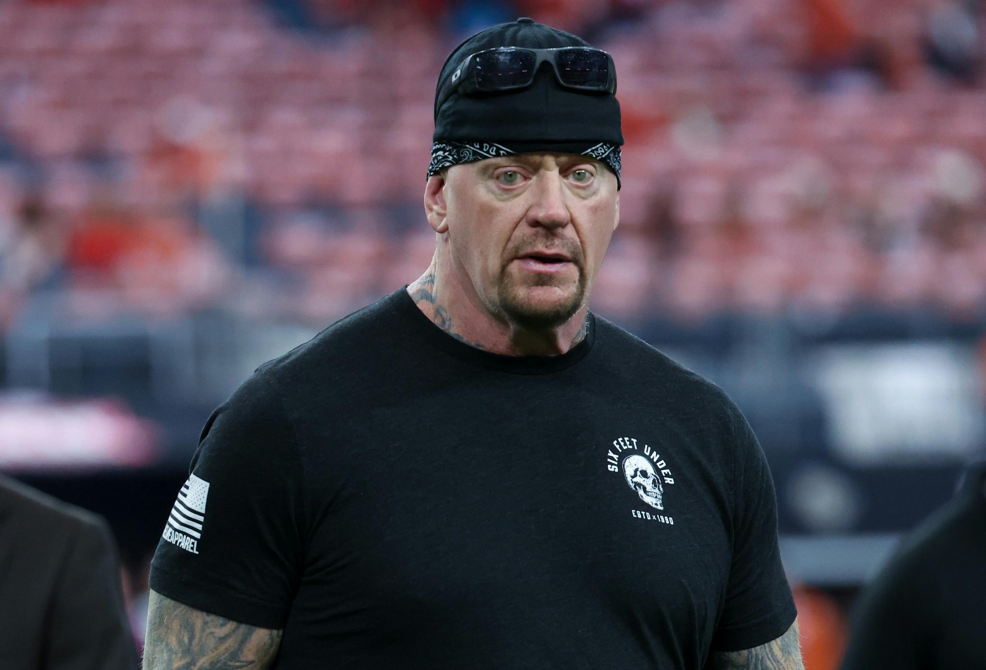 Mark Calaway, also known as the Undertaker from WWE wrestling, in attendance before the game between the Texas Longhorns and Oklahoma State Cowboys at AT&T Stadium.