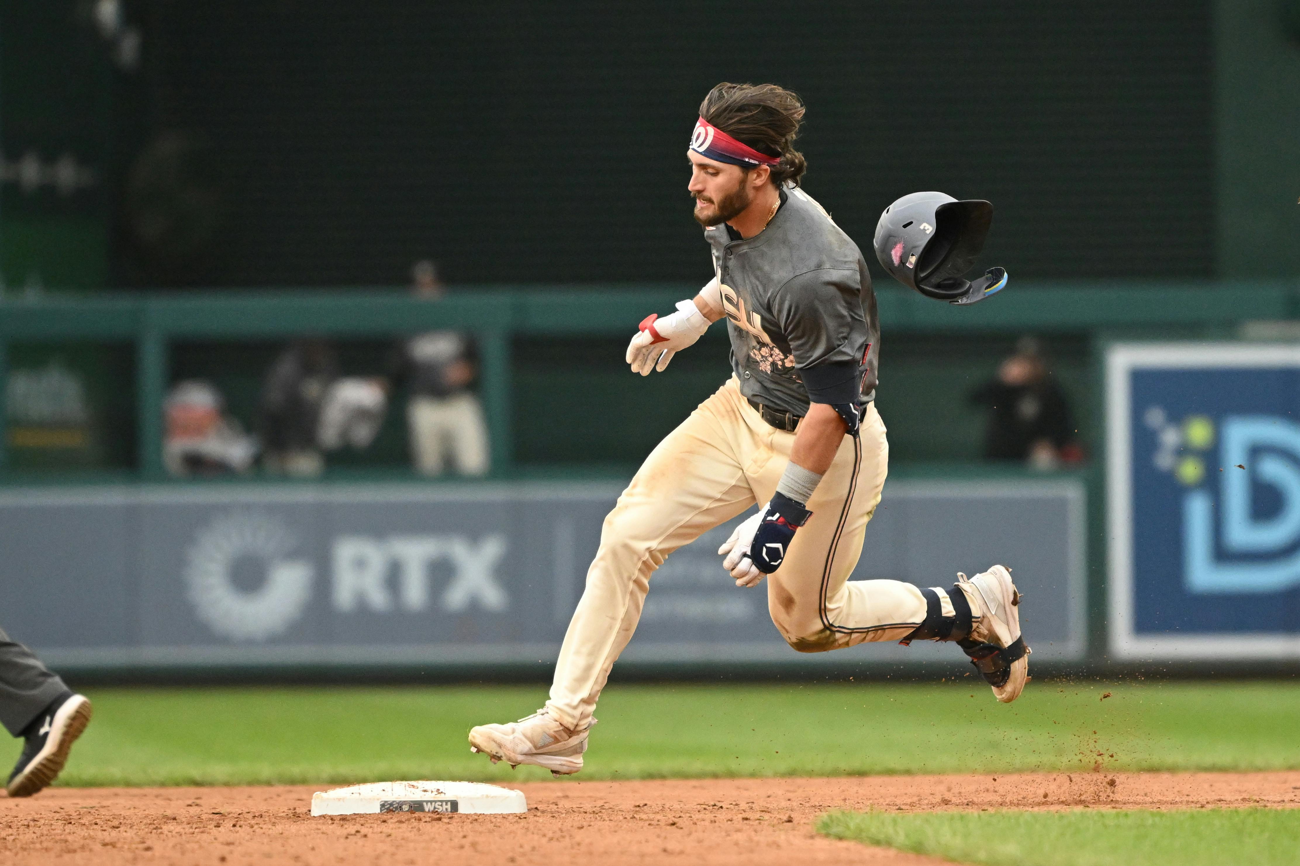 Washington Nationals right-fielder Dylan Crews rounds second base after hitting a triple against the Philadelphia Phillies during the sixth inning at Nationals Park, and he