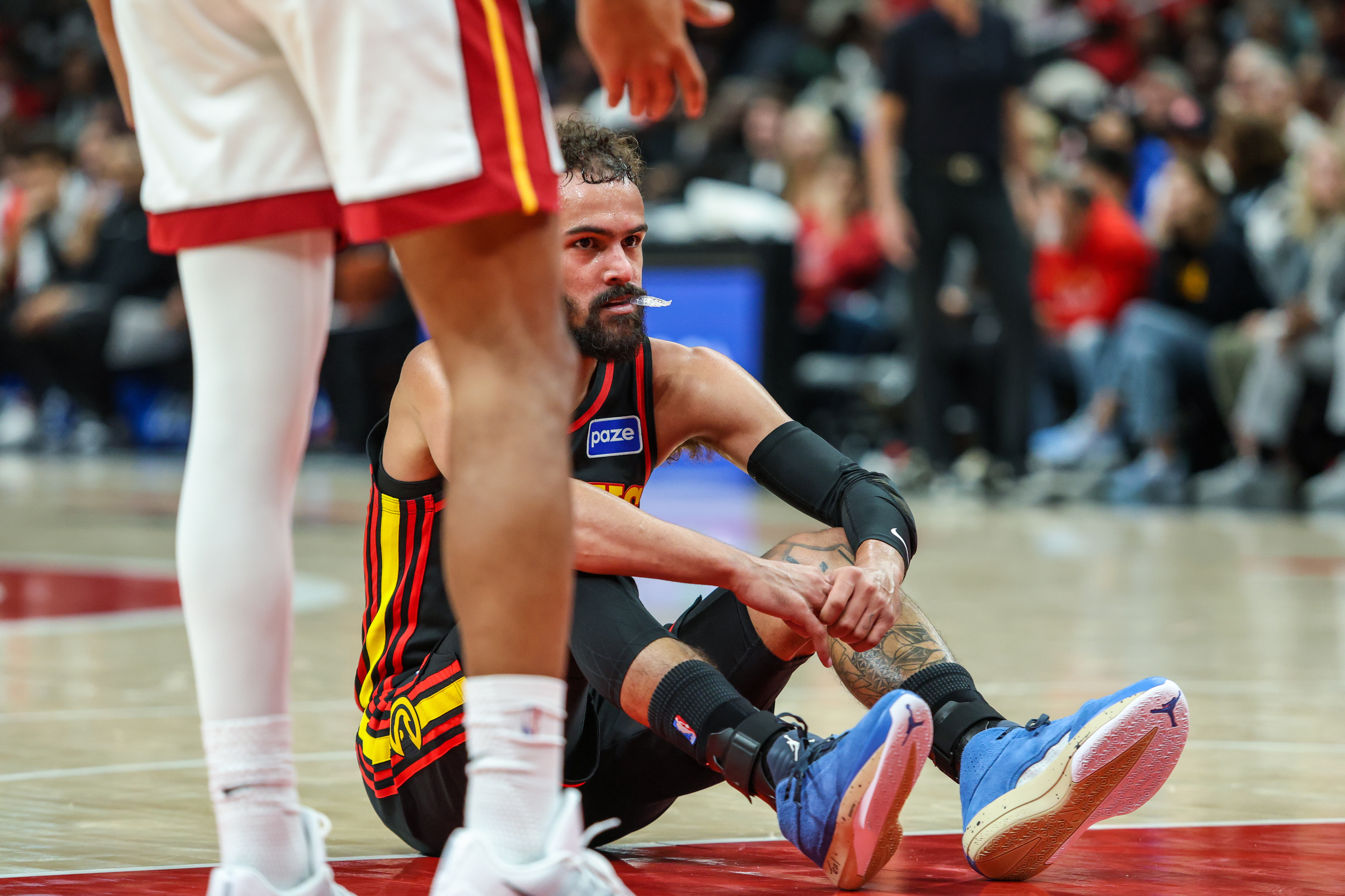 Atlanta Hawks guard Trae Young (11) sits on the court after being fouled as we look at the Trae Young next team prediction market