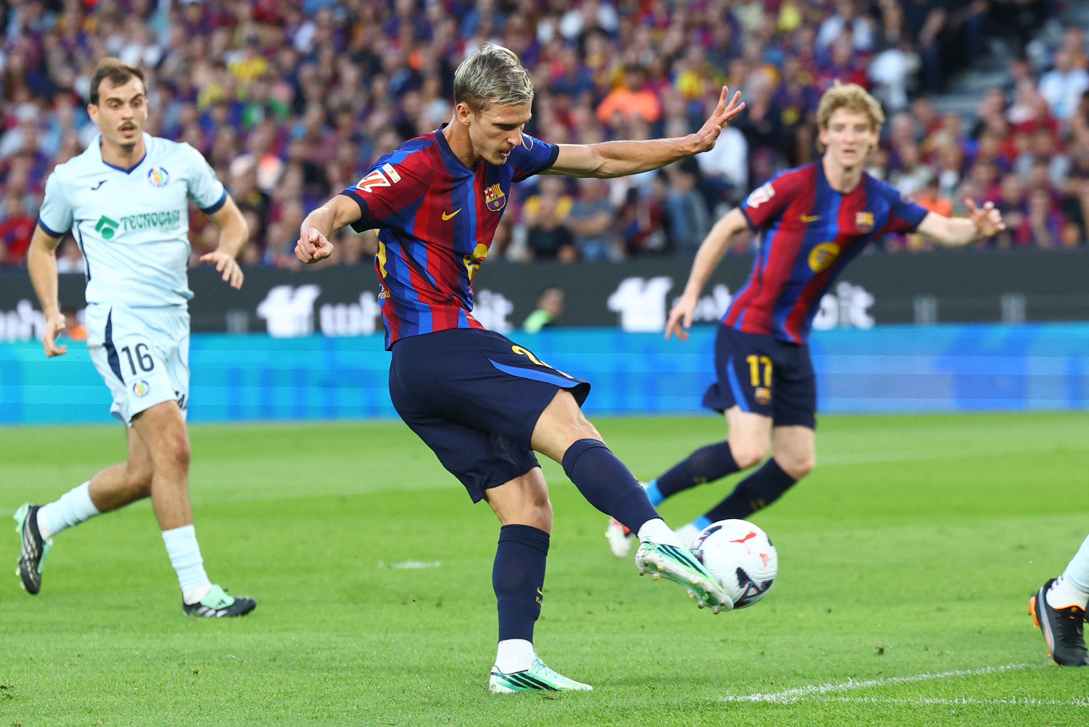 Barcelona's Dani Olmo shoots as we make our best PSG vs. Barcelona prediction