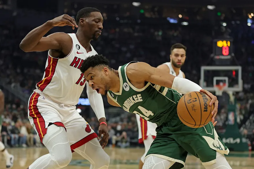 Giannis Antetokounmpo #34 of the Milwaukee Bucks is defended by Bam Adebayo #13 of the Miami Heat as we make our Bucks vs. Heat NBA player prop bets.