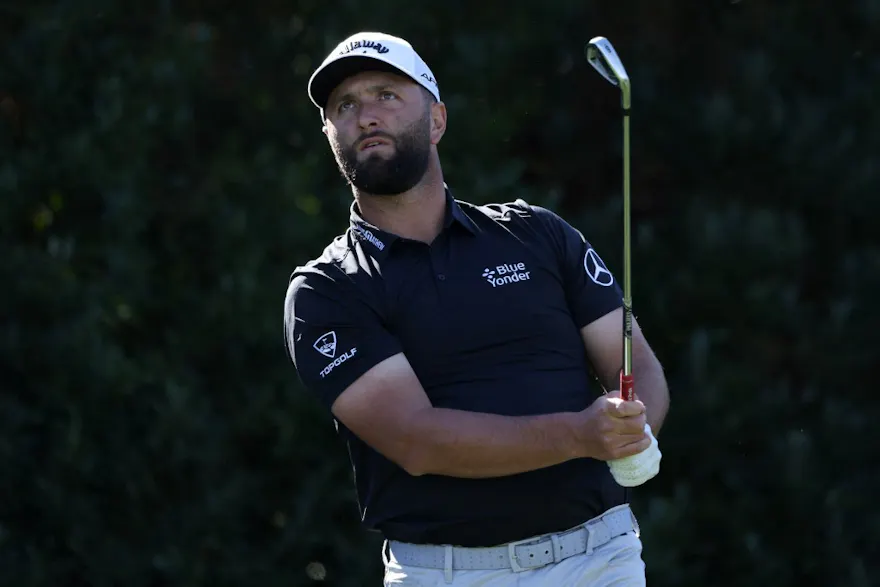 Jon Rahm of Spain watches his shot as we look at how to stream The Players Championship final round