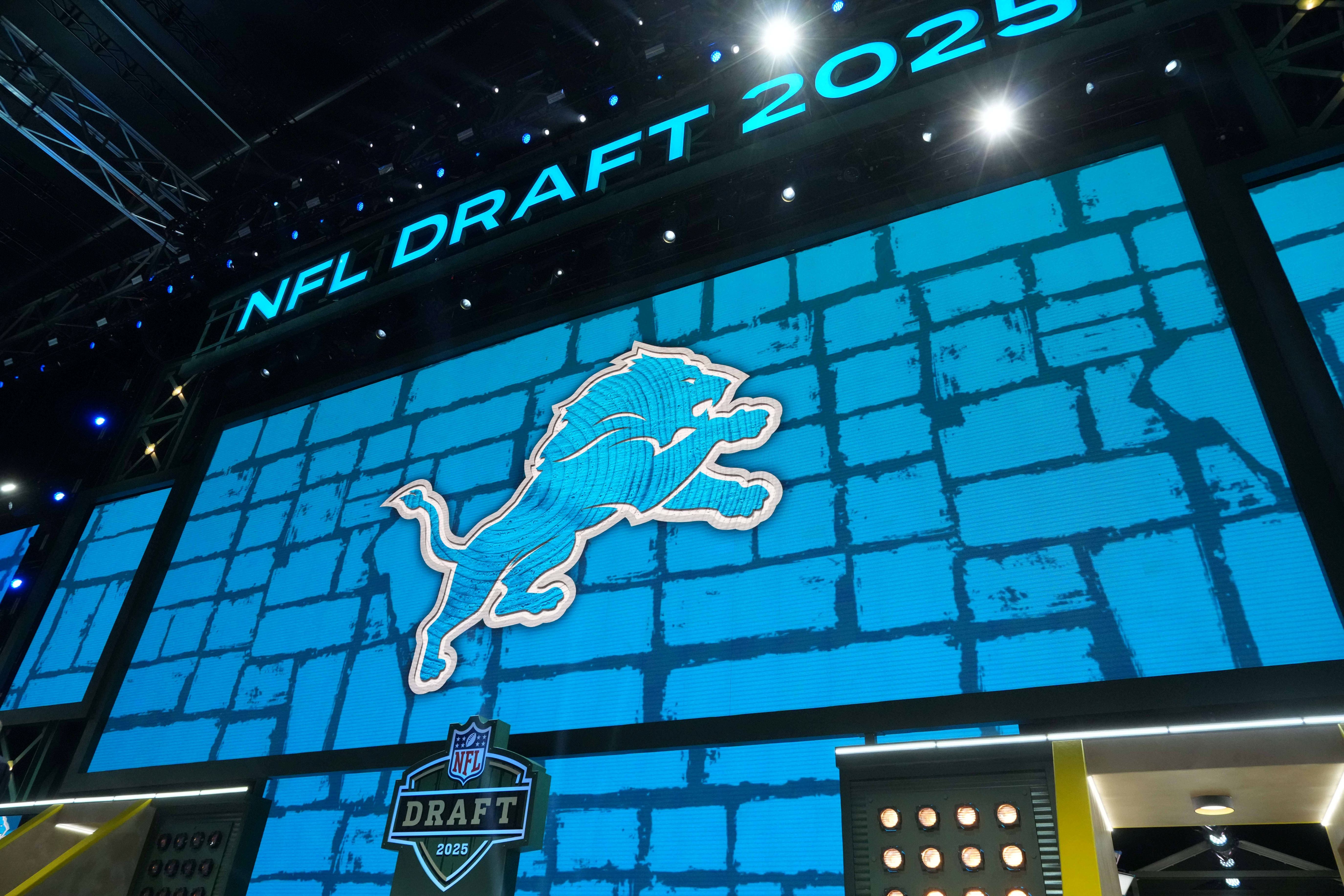 The Detroit Lions logo is projected on draft stage screen during the NFL Draft at Lambeau Field.