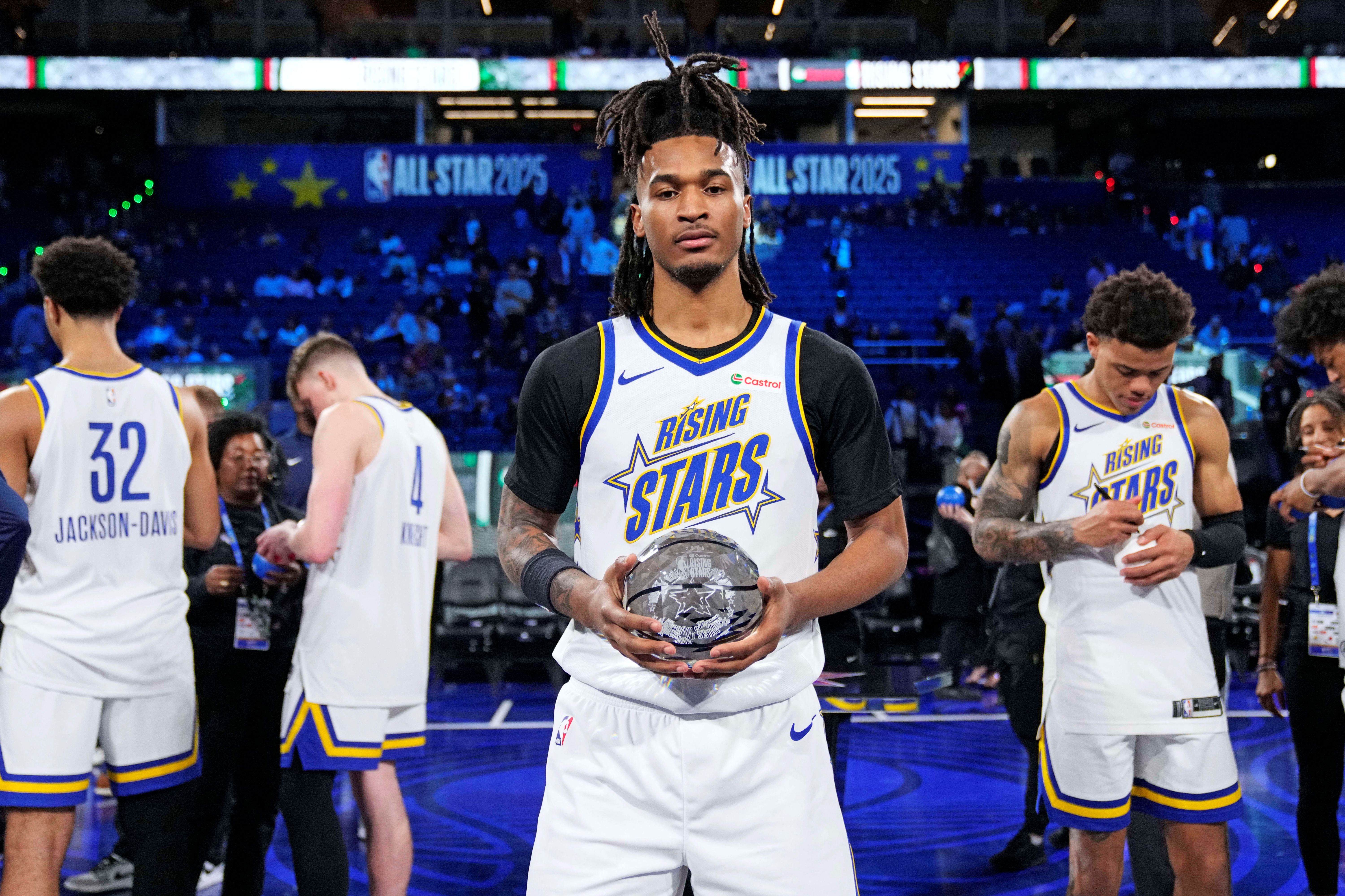 San Antonio Spurs guard Stephon Castle (5) holds a trophy as we break down our NBA Rising Stars predictions today.