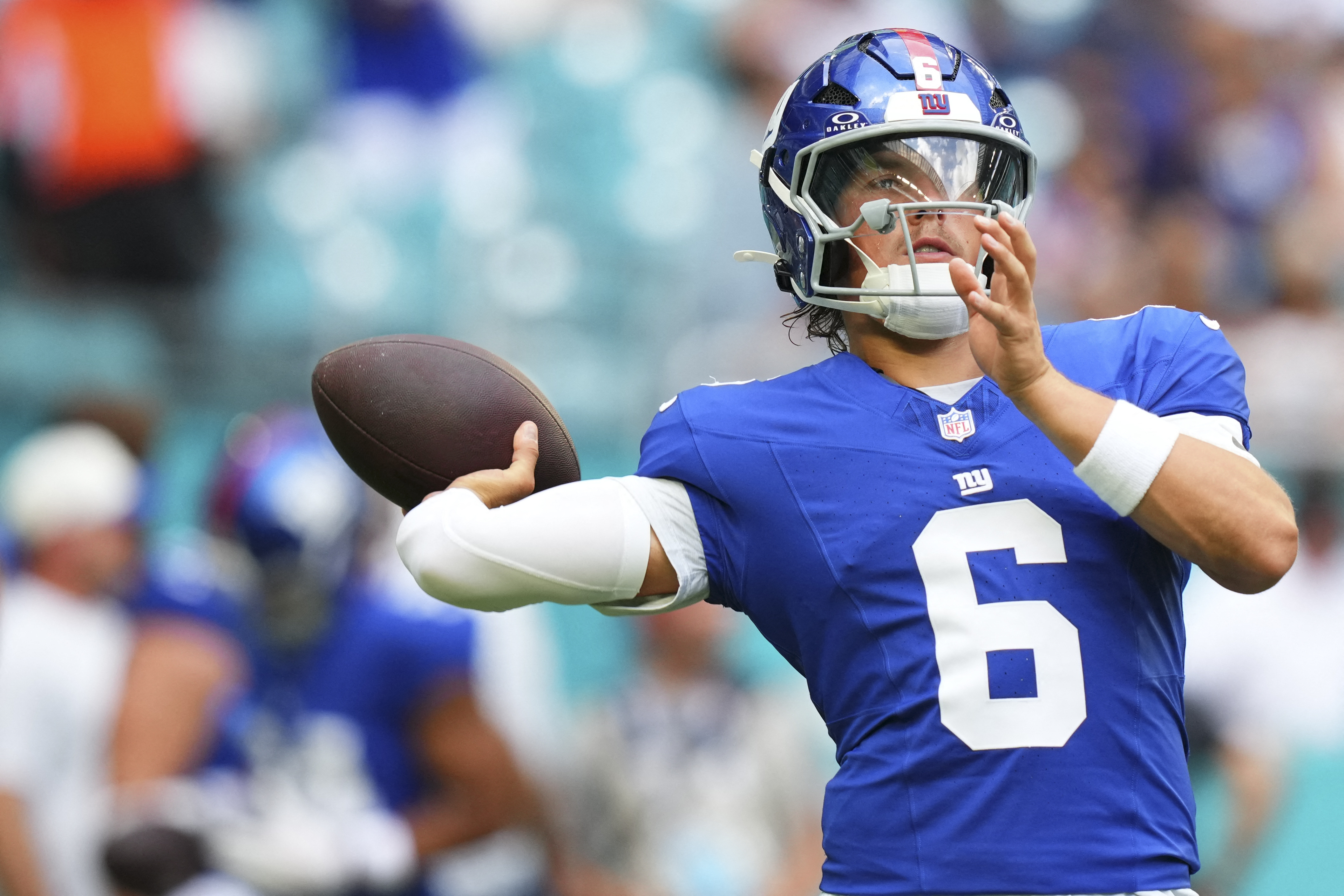 New York Giants quarterback Jaxson Dart (6) warms up as he is featured in our NFL MVP odds.