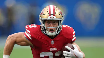 Christian McCaffrey of the San Francisco 49ers on a run during a 30-23 49ers win over the Los Angeles Rams as we look at our Giants-49ers prediction.