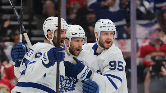 Toronto Maple Leafs center John Tavares (91) celebrates with teammates after scoring, and he is projected to do so again in our Maple Leafs vs. Sabres player props tonight.