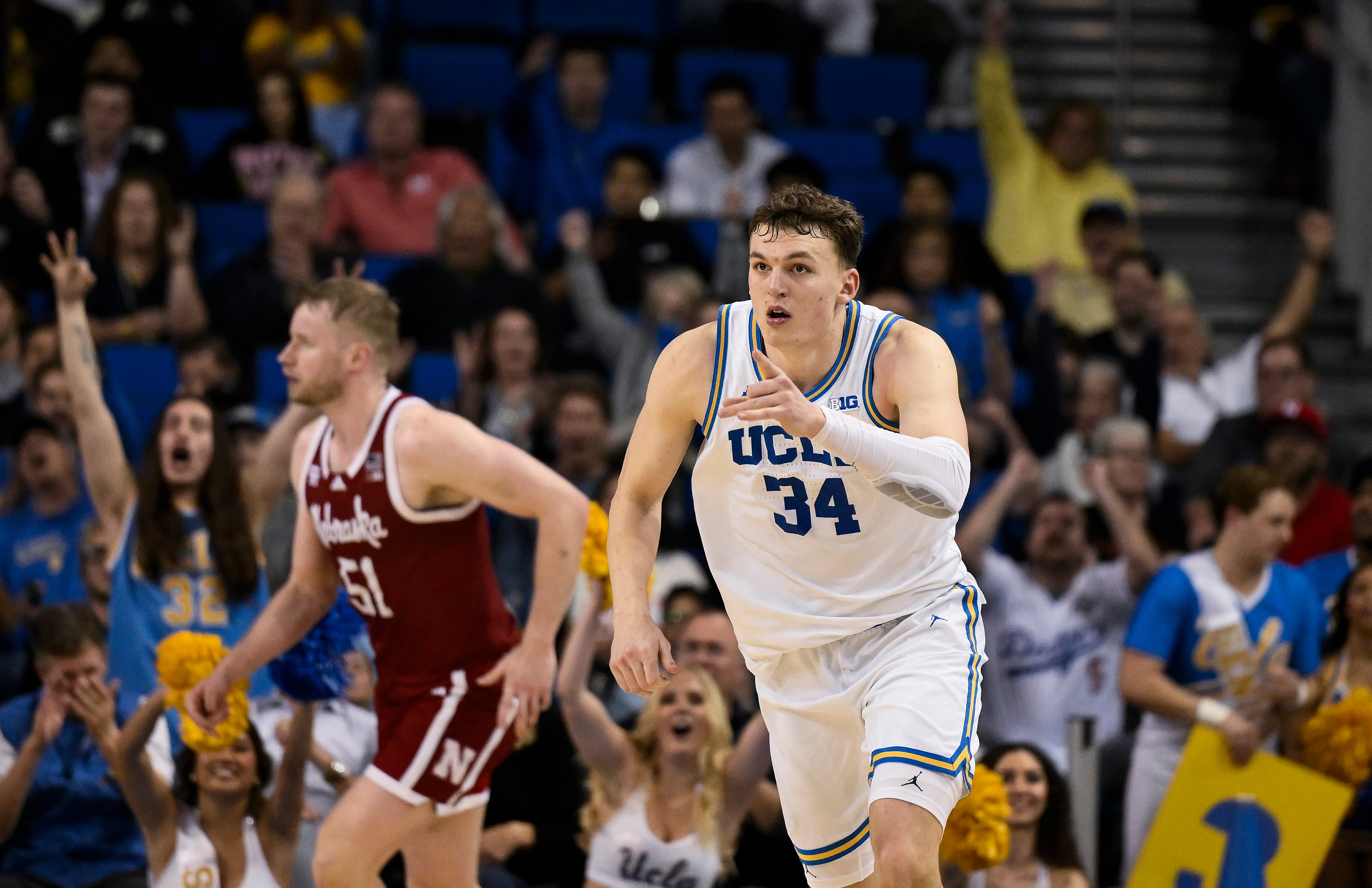 UCLA Bruins forward Tyler Bilodeau (34) points to teammates after hitting a 3-point jumpshot as we break down our UCF vs. UCLA prediction & picks.