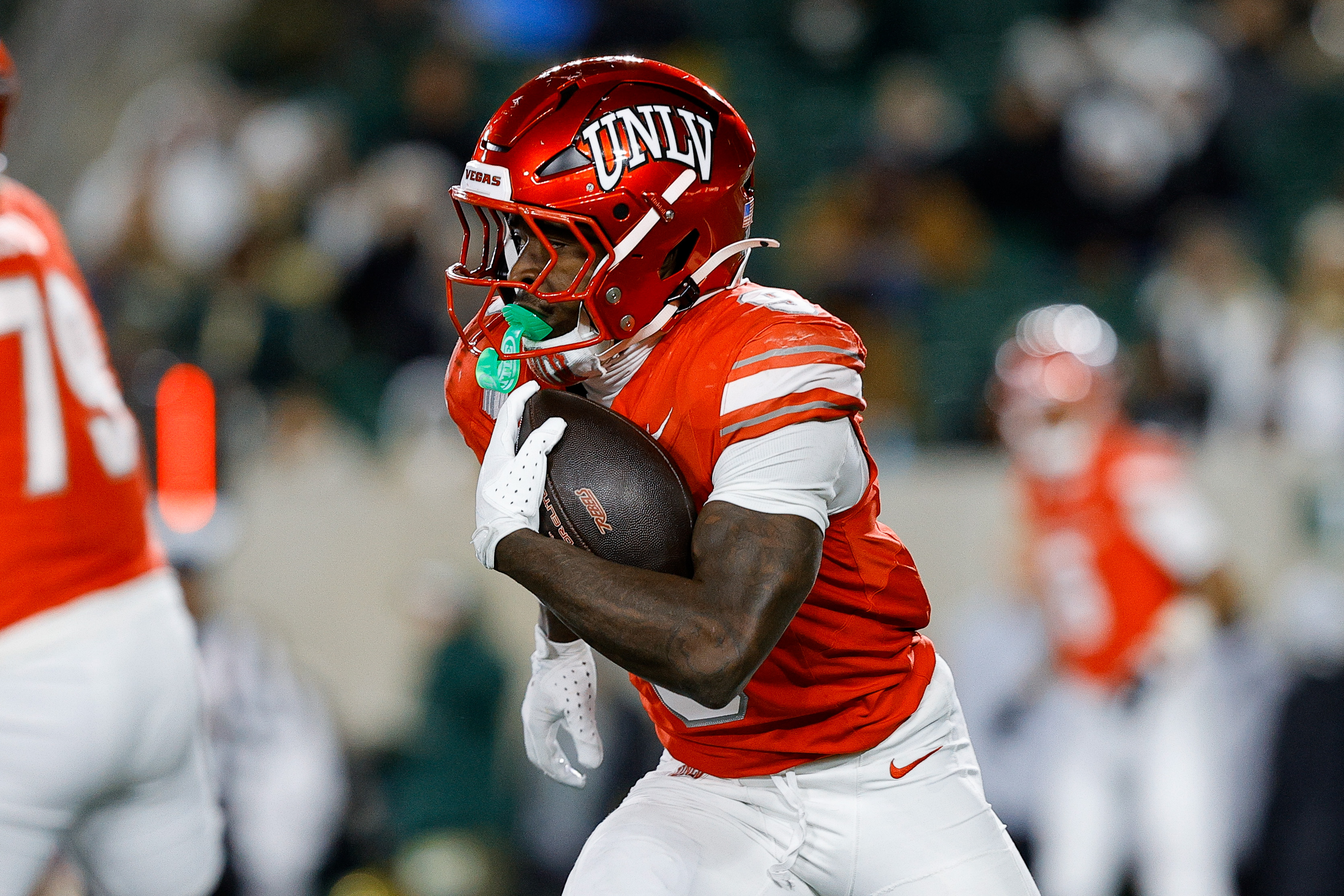 UNLV Rebels running back Jai'Den Thomas (9), seen here running the ball, is featured in our UNLV vs. Ohio predictions today for the 2025 Frisco Bowl.