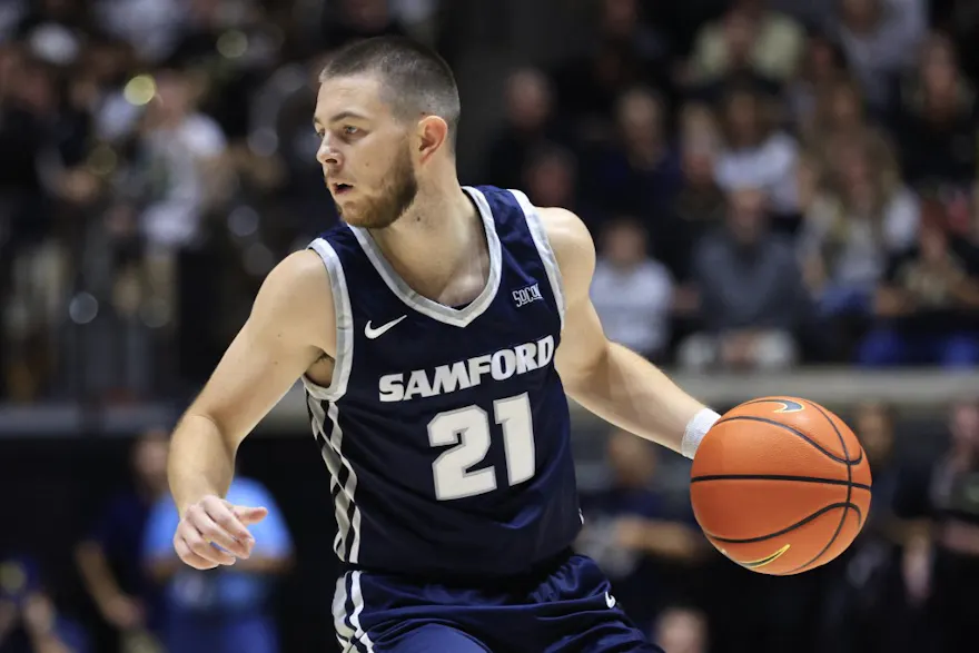Rylan Jones of the Samford Bulldogs brings the ball up the court during the first half of the game against the Purdue Boilermakers, and we offer our top March Madness first-round upset picks based on the best March Madness odds.