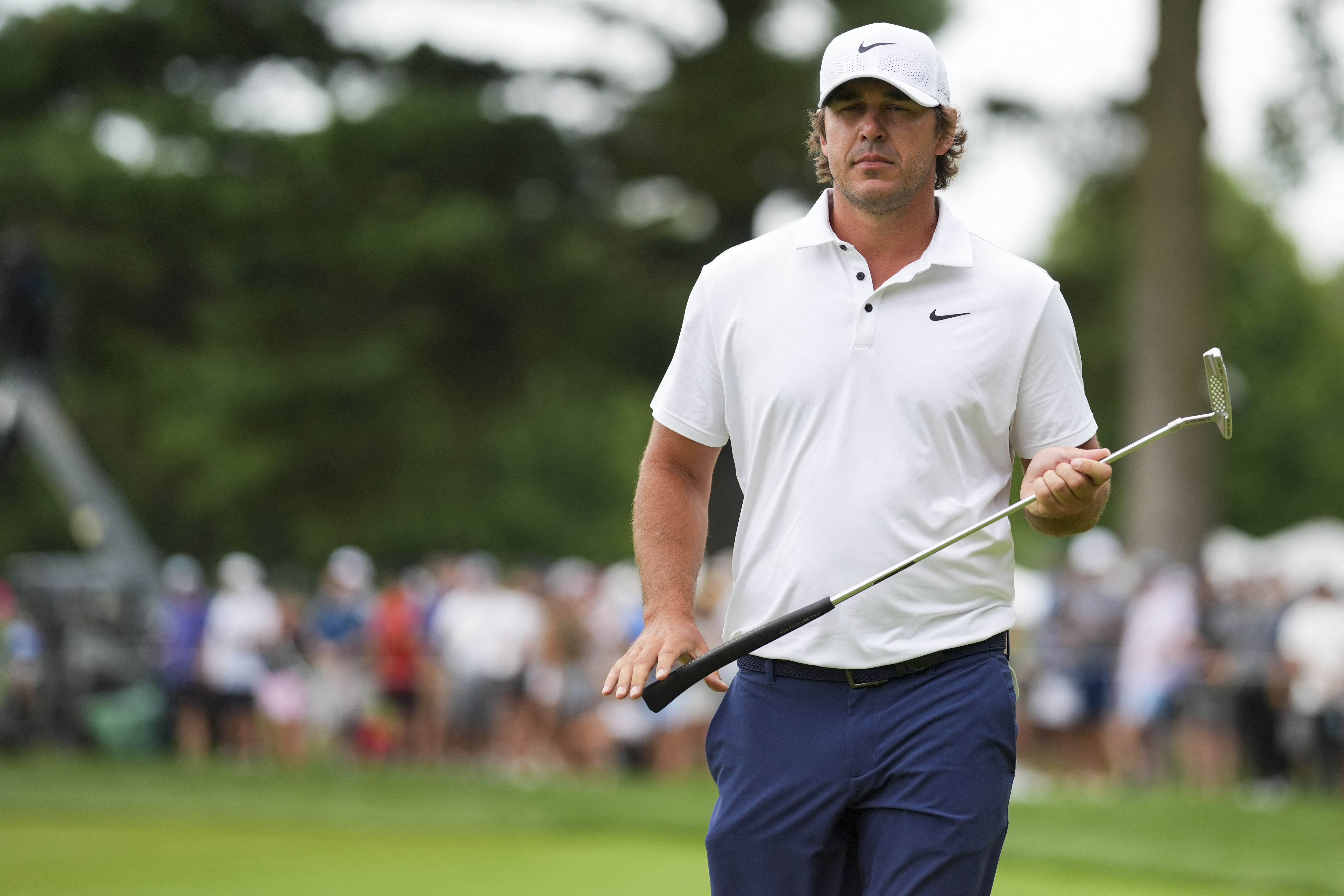 Brooks Koepka lines up a putt on the green as we look at his major odds and 2026 PGA Tour schedule