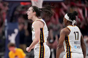 Caitlin Clark (22) and Erica Wheeler (17) of the Indiana Fever celebrate as we offer our best Fever vs. Storm prediction and expert picks for Wednesday's game at Climate Pledge Arena.