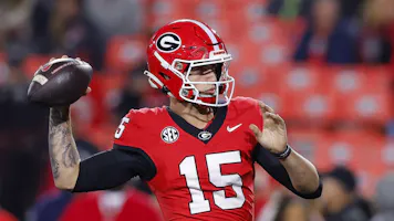 Carson Beck of the Georgia Bulldogs warms up before the game against the Mississippi Rebels, and we offer new U.S. bettors our exclusive Caesars promo code.