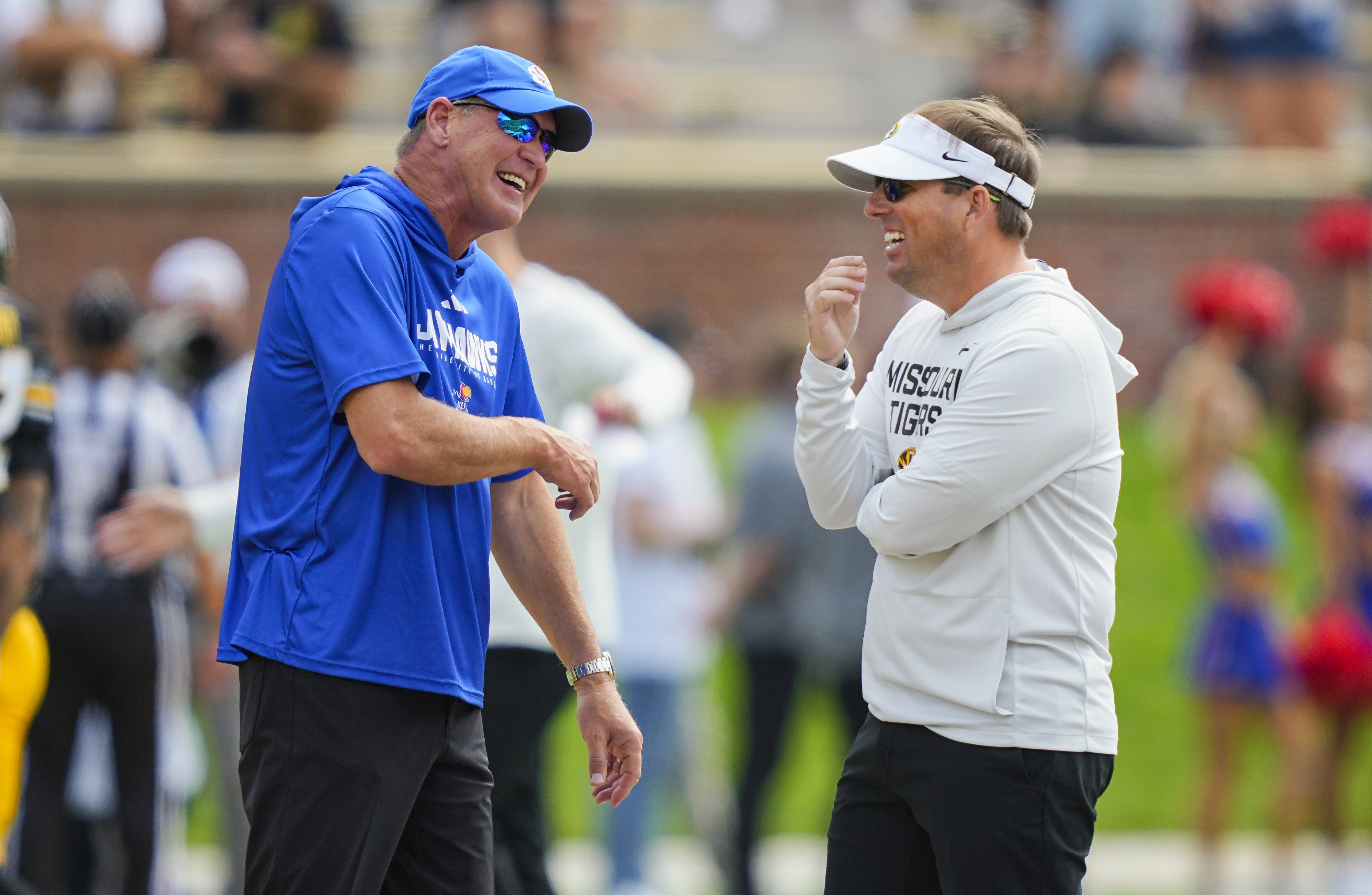 Kansas coach Lance Leipold talks with Missouri coach Eliah Drinkwitz as we look at the upcoming decrease in border crossings from Missouri to bet.