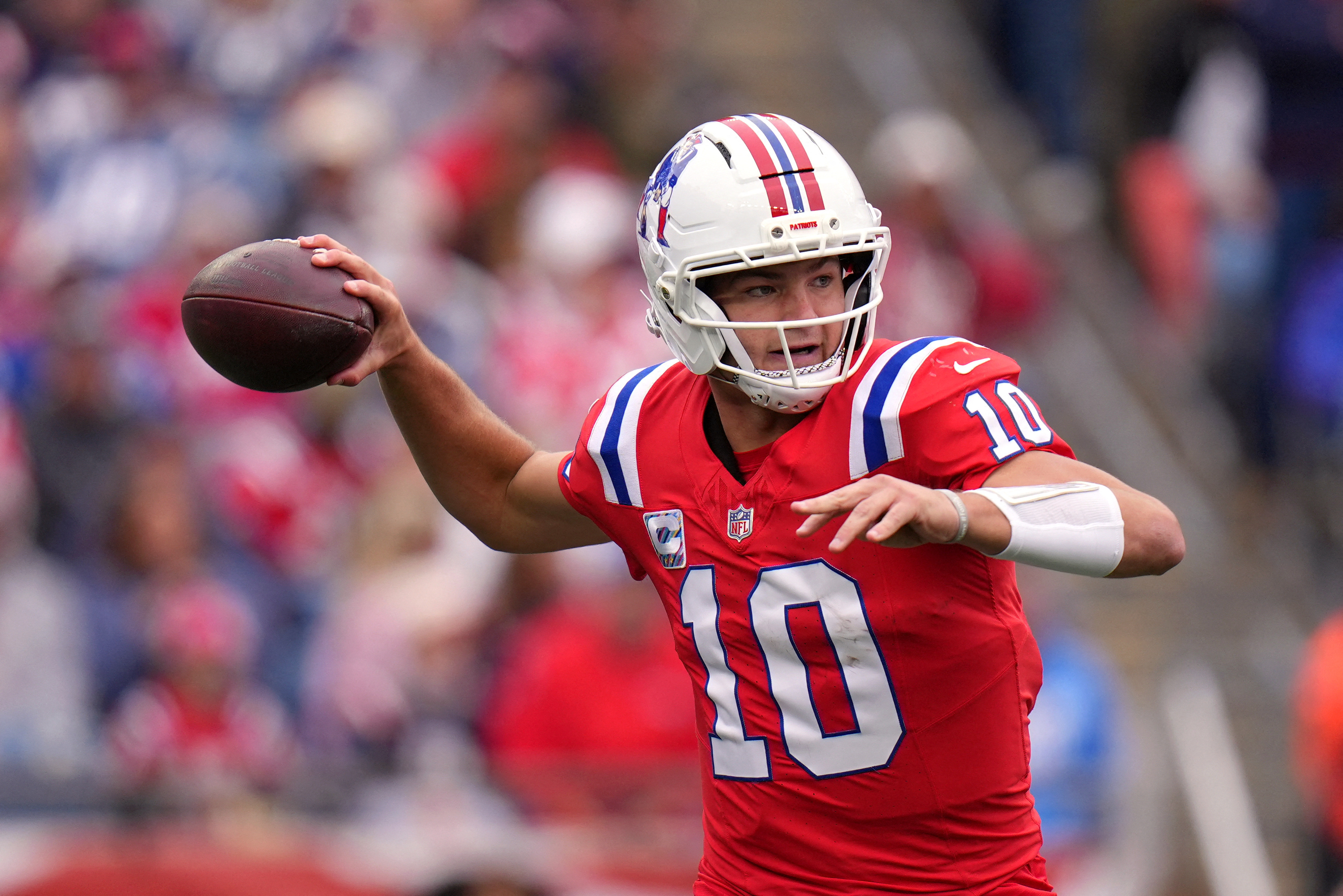 Pictured: Drake Maye throwing a pass as we break down our Patriots vs. Dolphins Prediction. Photo by David Butler II-Imagn Images.