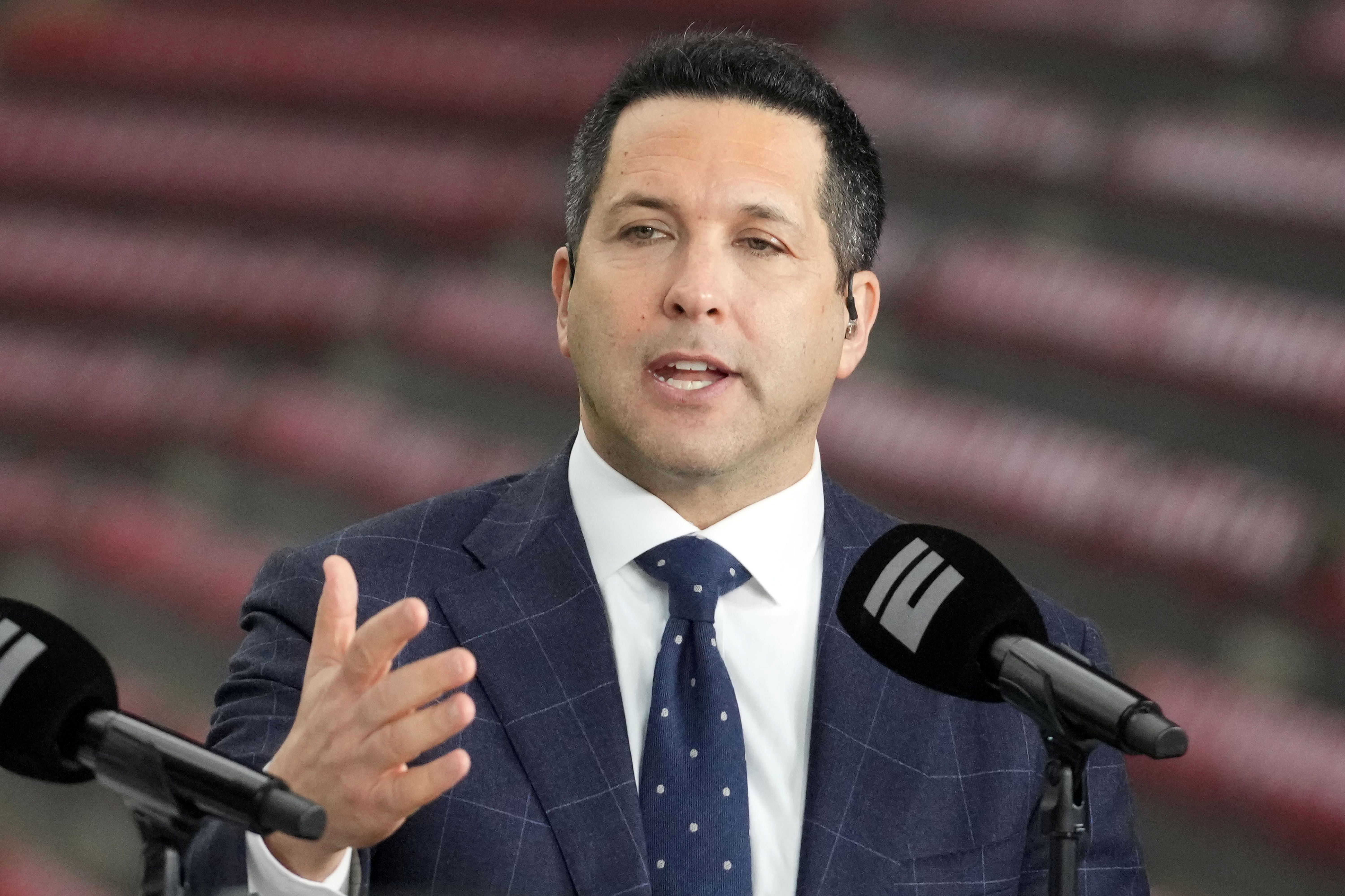 Adam Schefter talks on a set as we look at his early investment in Underdog.