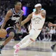 De'Aaron Fox of the Sacramento Kings drives to the basket past Malaki Branham of the San Antonio Spurs. We expect a big night from Fox in our Lakers vs. Kings NBA player props.