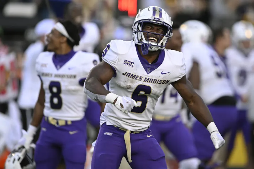 Kaelon Black of the James Madison Dukes celebrates in the last few seconds of the fourth quarter against the Appalachian State Mountaineers as we look at our college football parlay picks.