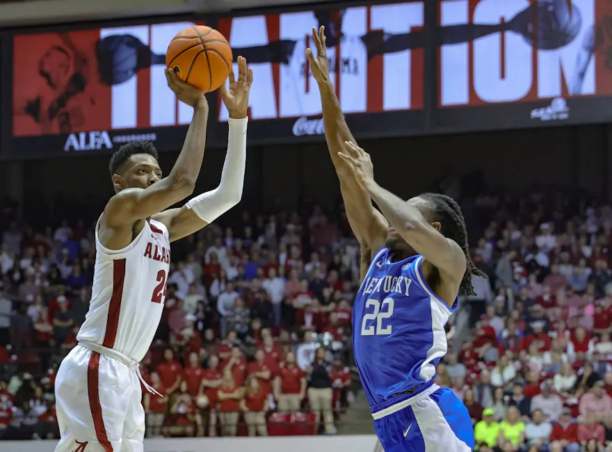 Brandon Miller of the Alabama Crimson Tide puts up a three over Cason Wallace of the Kentucky Wildcats at Coleman Coliseum on Jan. 7, 2023 in Tuscaloosa, Alabama.