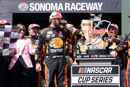 Martin Truex Jr. (19) celebrates with his team as we offer our best Toyota/Save Mart 350 odds and expert picks for Sunday's race at Sonoma Raceway.