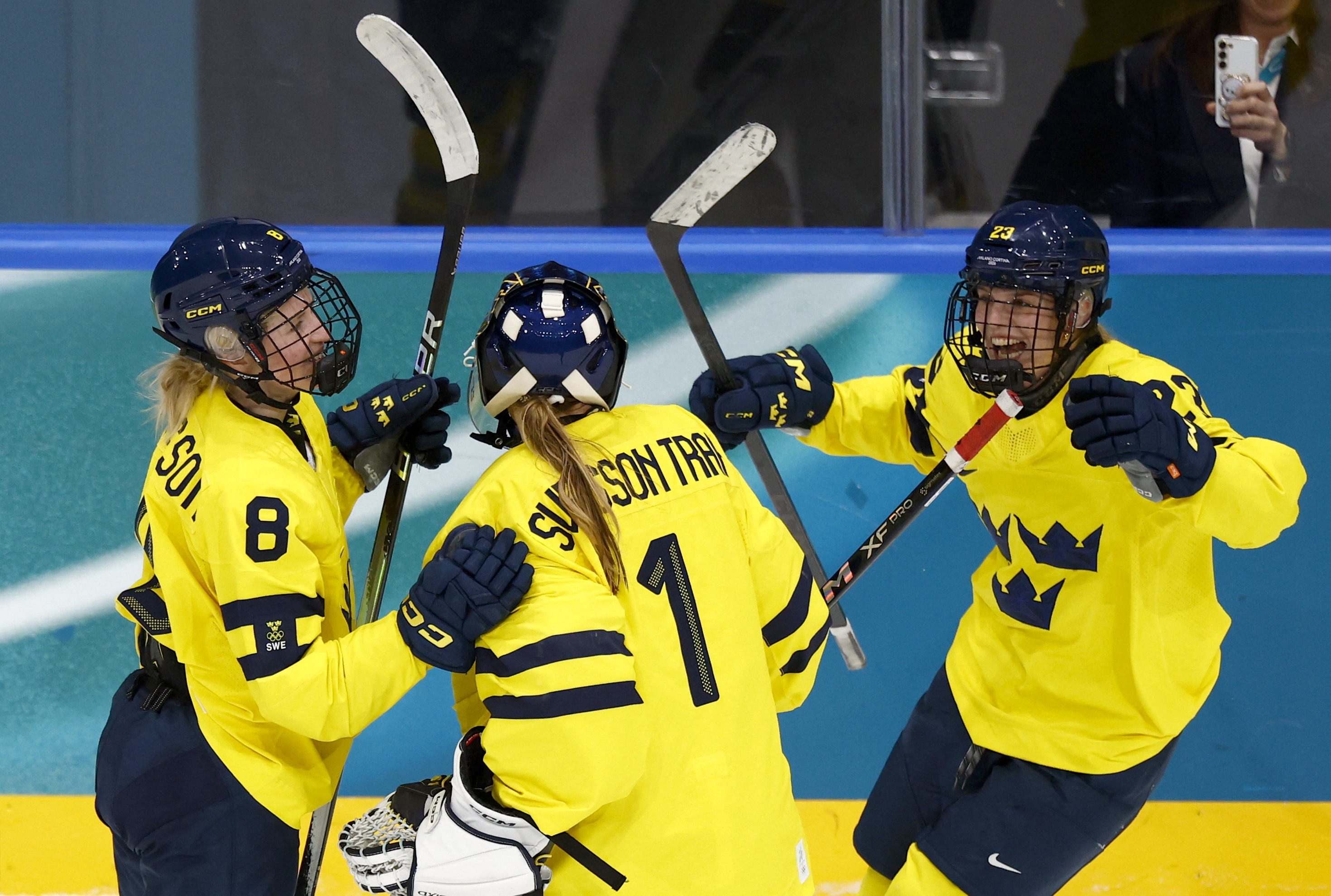 Hilda Svensson, Ebba Svensson Traff, and Thea Johansson of Sweden celebrate as we make our best Sweden vs. Switzerland prediction for the Bronze Medal game. 
