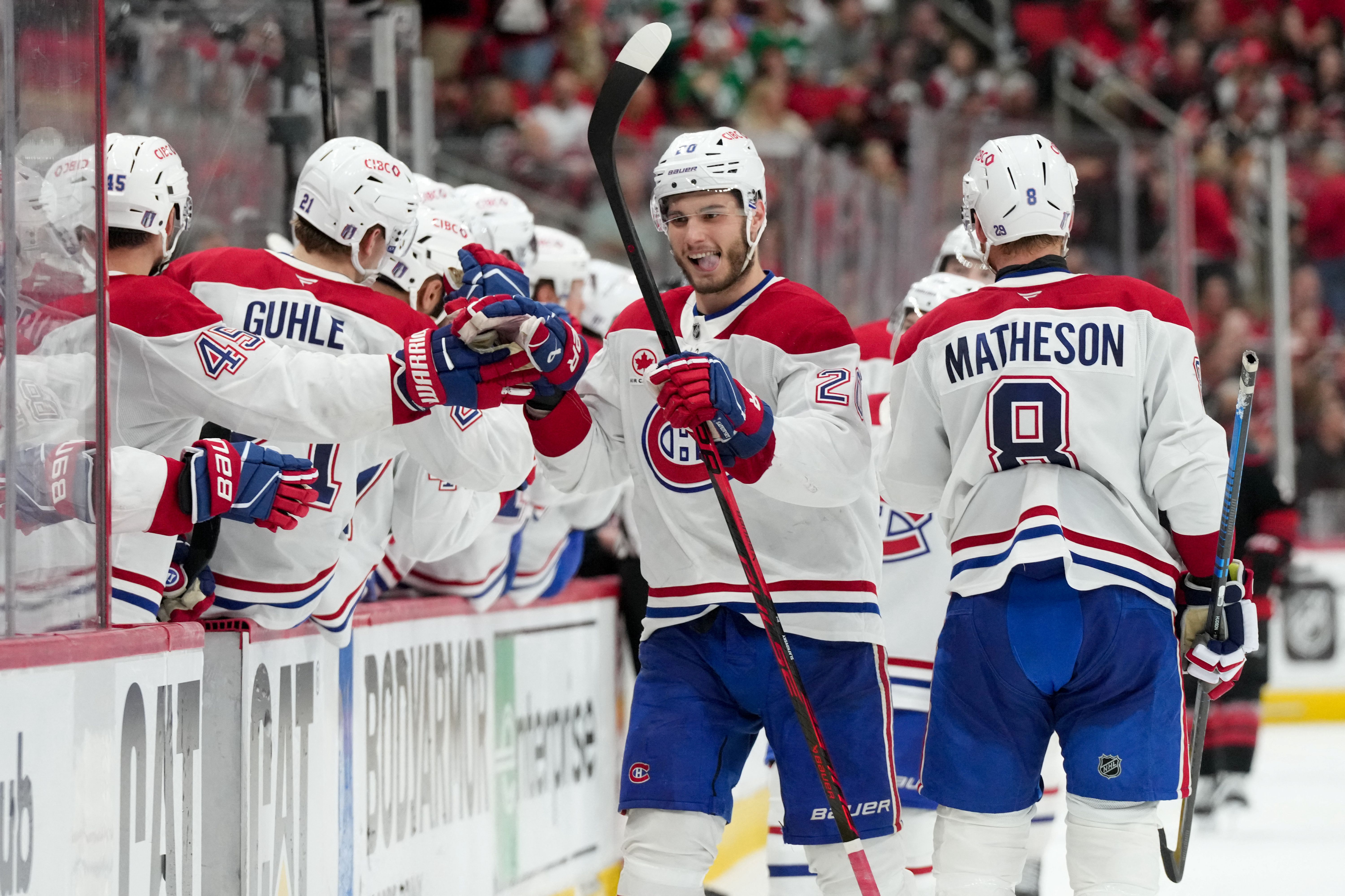 Montreal Canadiens left wing Juraj Slafkovsky (20) celebrates with teammates as we break down our Hurricanes vs. Canadiens prediction and odds for Game 4 tonight.