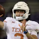 Quinn Ewers of the Texas Longhorns warms up before playing against the TCU Horned Frogs at Amon G. Carter Stadium on Nov. 11 as we look at our Oklahoma State-Texas prediction.