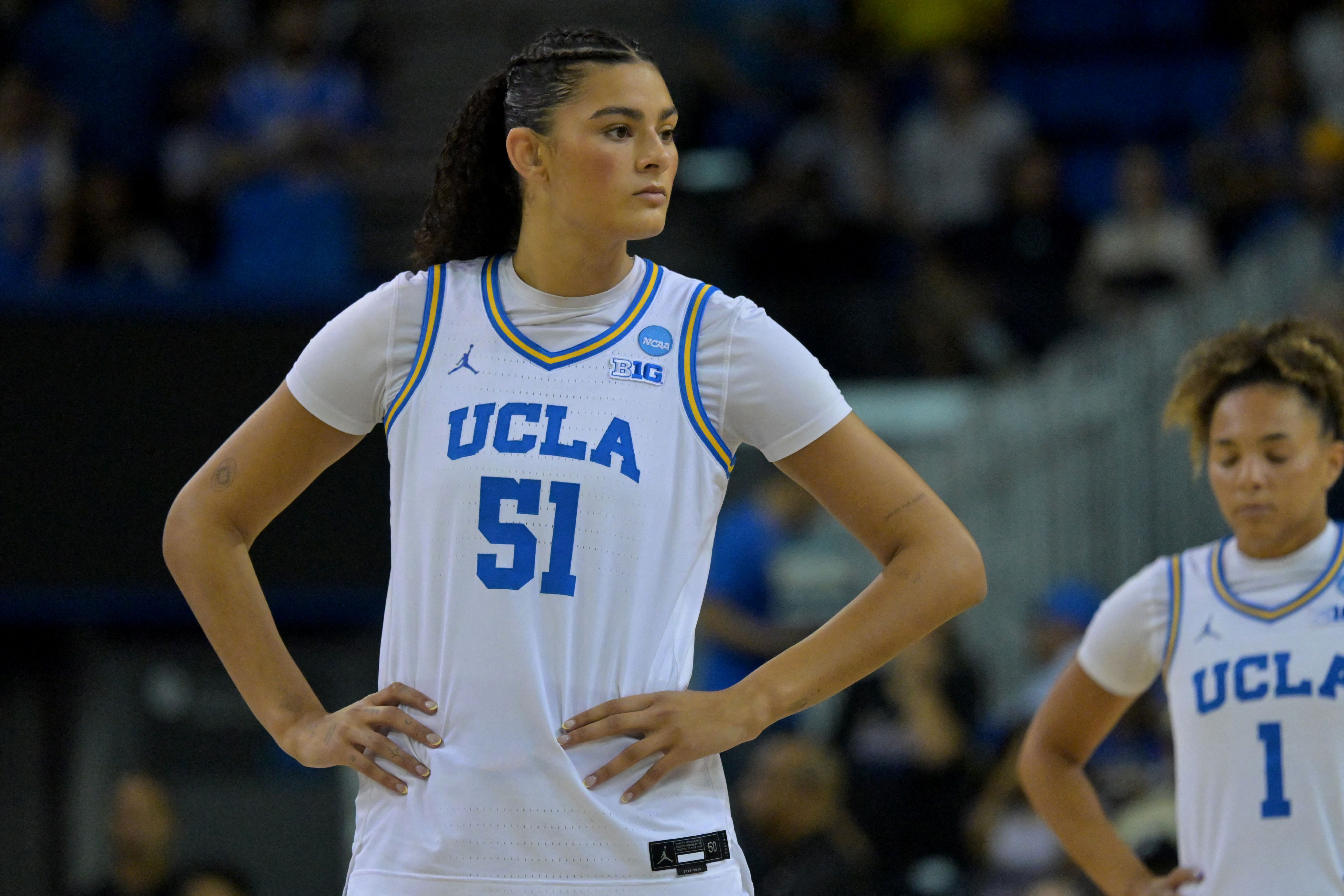 UCLA Bruins center Lauren Betts waits at center court, and she's key as we look at our Texas vs. UCLA prediction.
