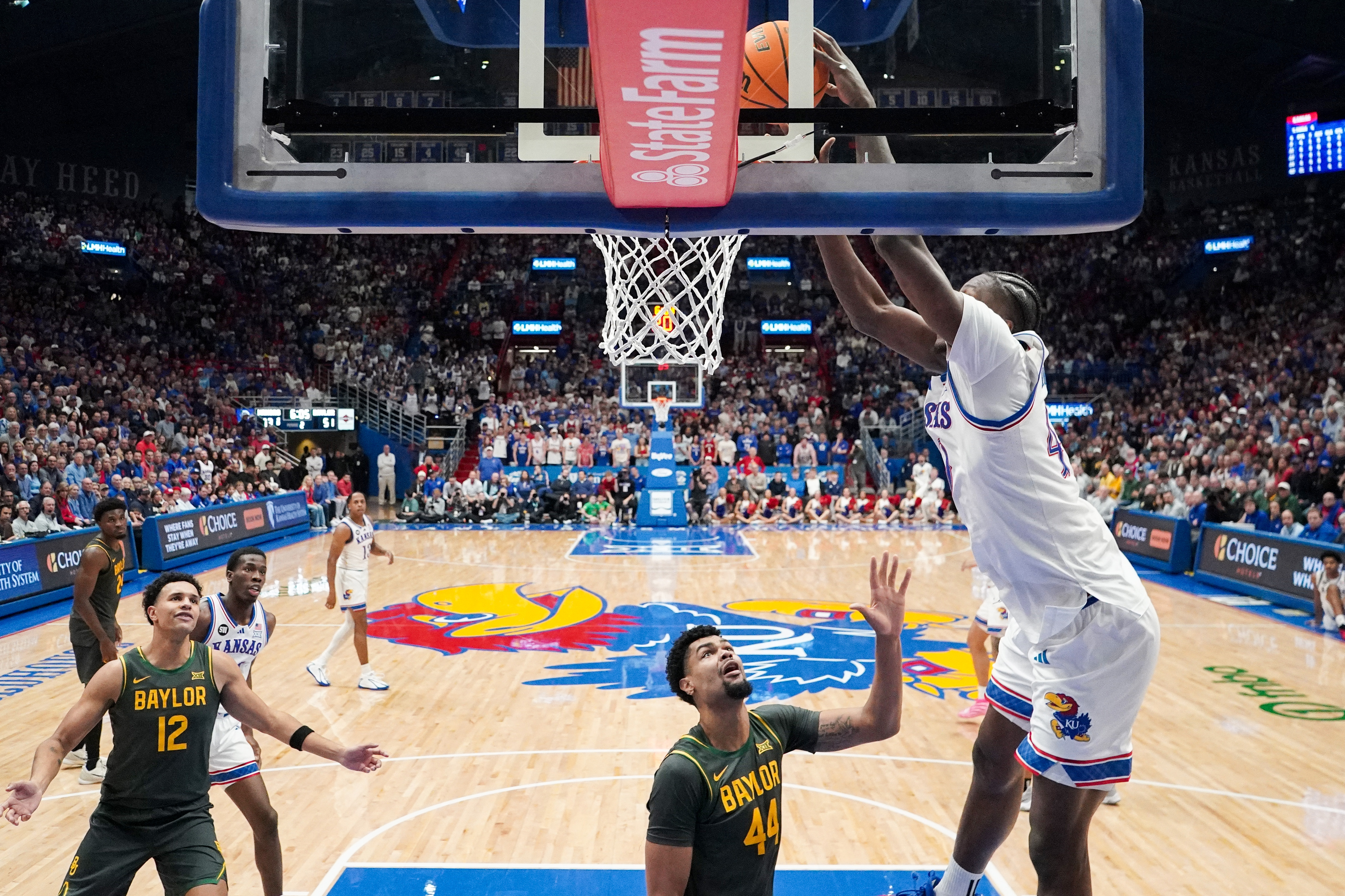 Kansas Jayhawks forward Flory Bidunga (40) dunks the ball as we break down our Kansas vs. Iowa State prediction, picks & odds.