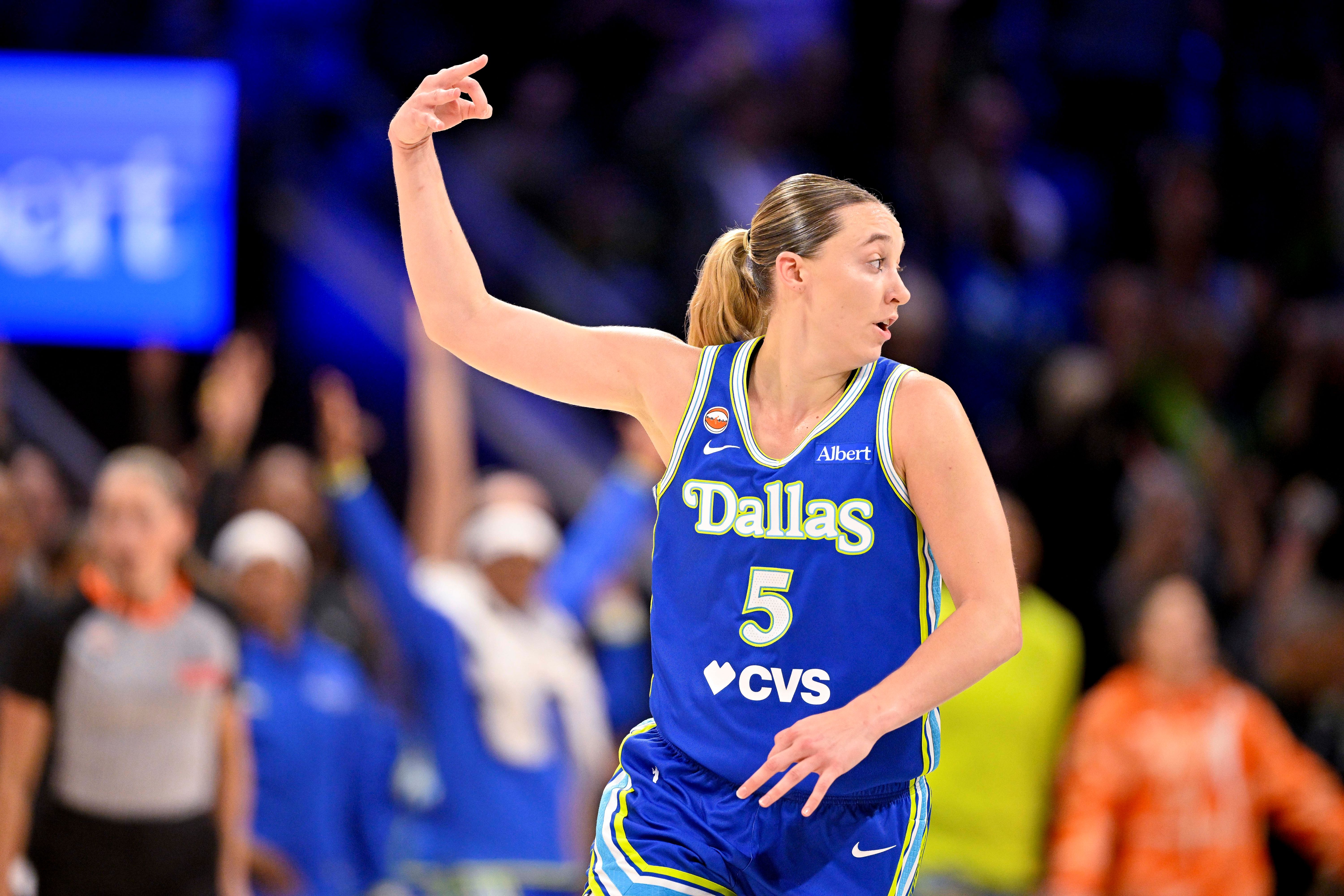 Dallas Wings guard Paige Bueckers celebrates as we make our best Sun vs. Wings prediction. 