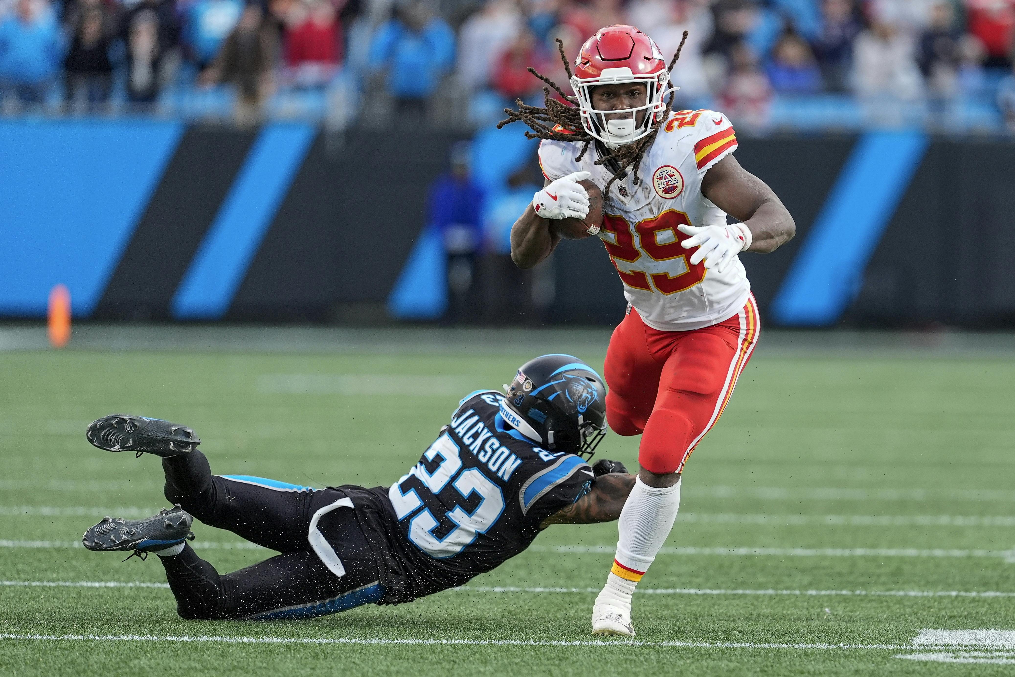 Kansas City Chiefs running back Kareem Hunt (29) tries to elude a defender as we look at our anytime touchdown scorer predictions for Week 14.