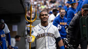 Julio Rodriguez of the Seattle Mariners poses with a trident in the dugout after hitting a solo home run against the Houston Astros, and we offer our best MLB bets for the 2024 season based on the best MLB odds.