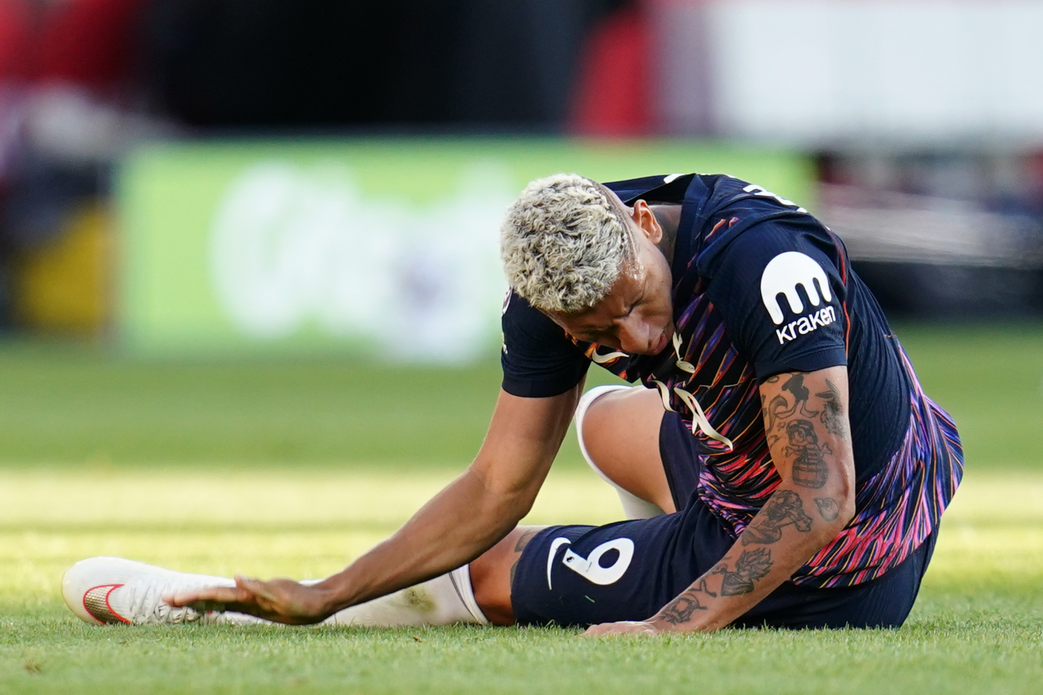 Richarlison of Tottenham Hotspur smacks the ground in frustration as we make our best Tottenham vs. Newcastle predictions.