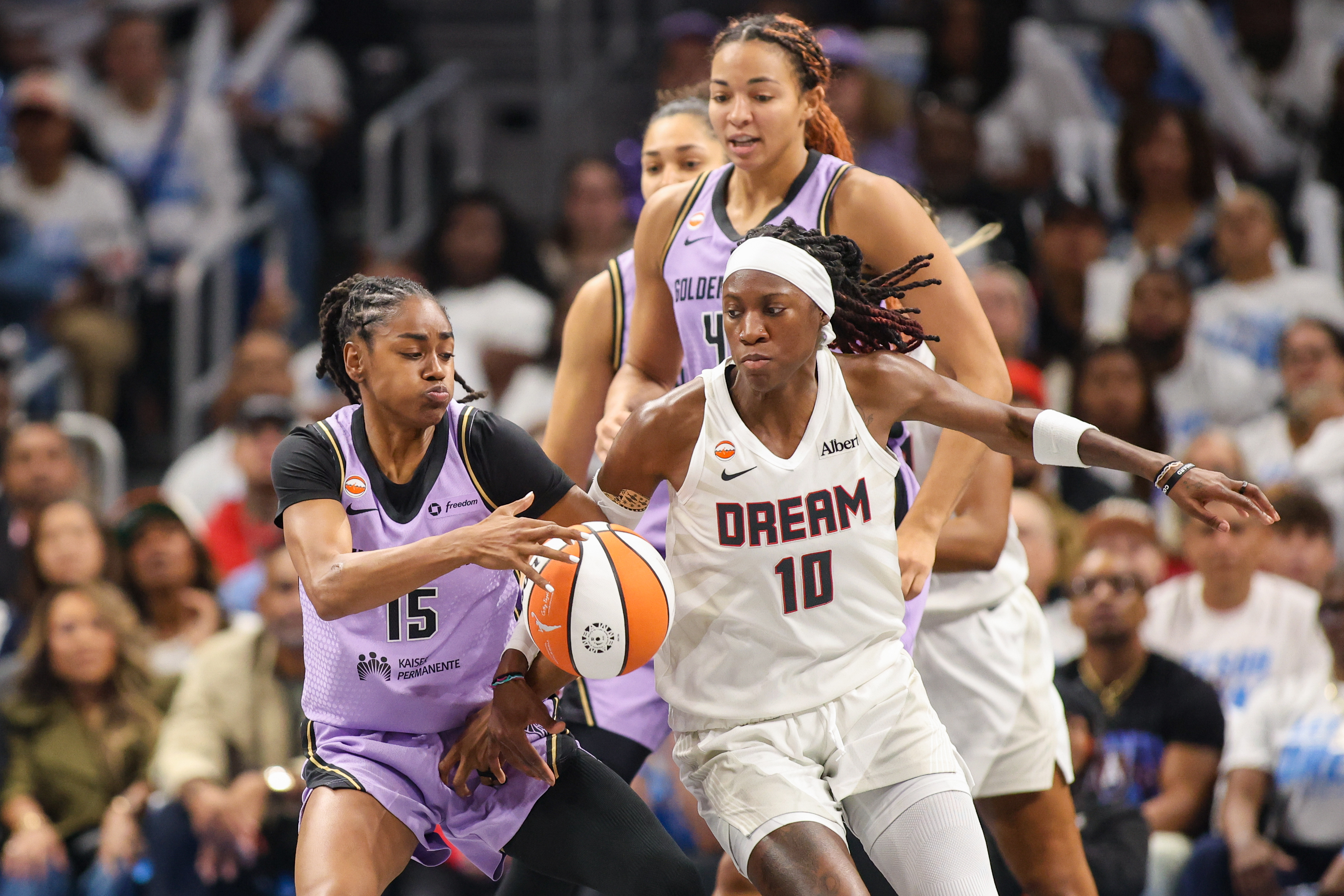 Golden State Valkyries guard Tiffany Hayes (15) reaches for a loose ball past Atlanta Dream guard Rhyne Howard (10) as we break down our Valkyries vs. Dream prediction.