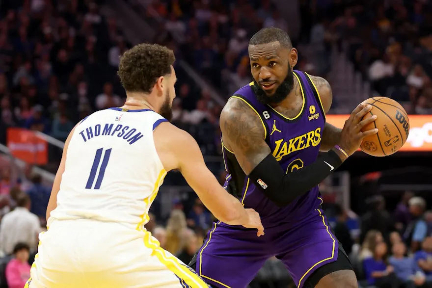 LeBron James of the Los Angeles Lakers is guarded by Klay Thompson as we look at the NBA Play-In Tournament odds