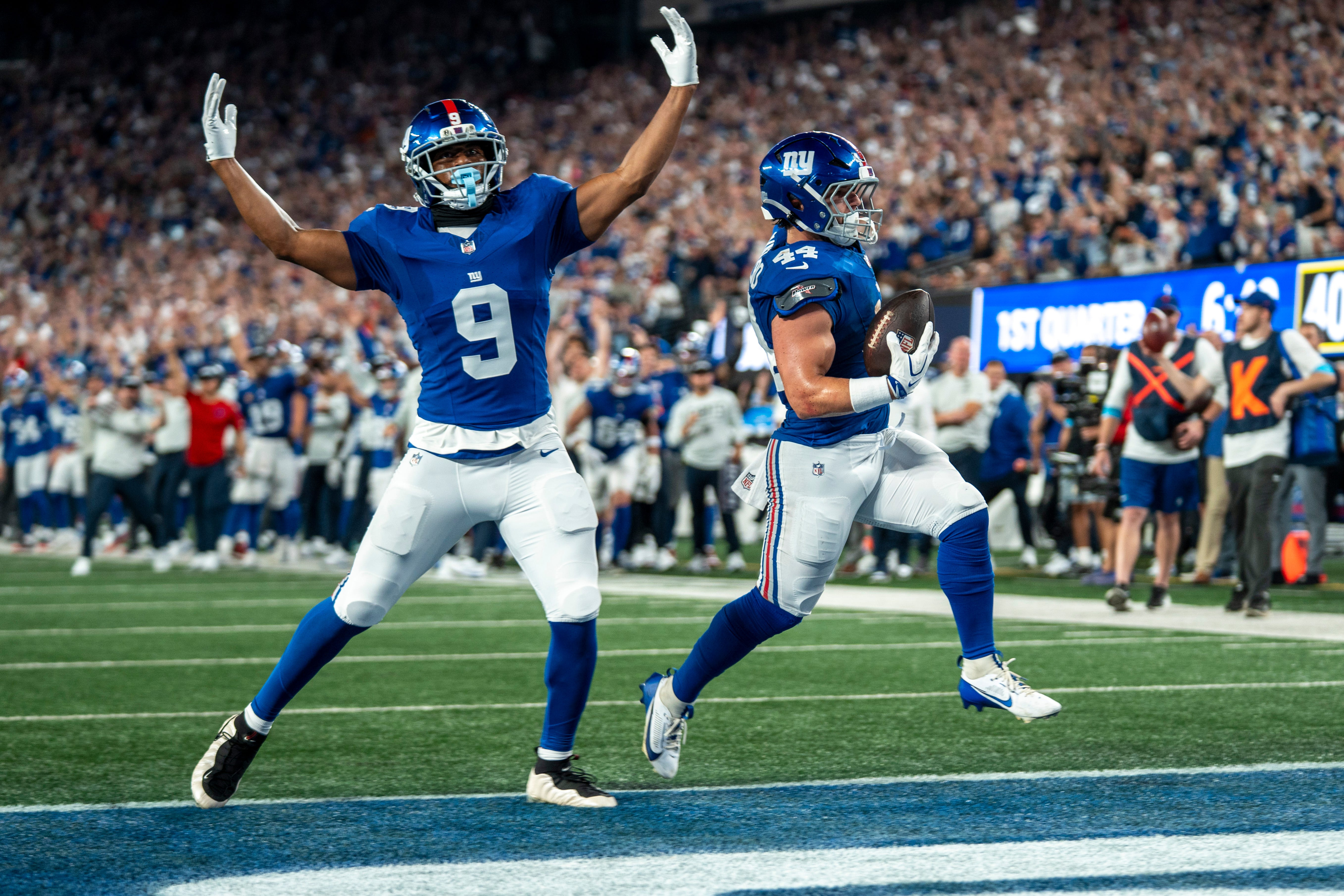 Giants running back Cam Skattebo runs the ball in for a touchdown, with teammate Isaiah Likely celebrating as we make our best Giants vs. Rams MNF expert picks