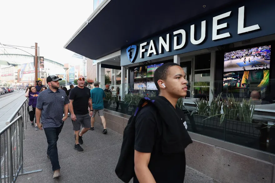 Fans walk past a Fanduel sports betting location at Footprint Center as we look at the FanDuel CEO speaking at the CNBC Evolve Global Summit.