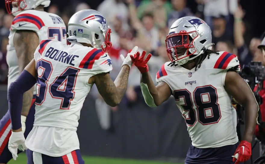 Kendrick Bourne and Rhamondre Stevenson of the New England Patriots celebrate Stevenson's 34-yard touchdown against the Las Vegas Raiders, and we offer new U.S. bettors our exclusive BetRivers promo code.